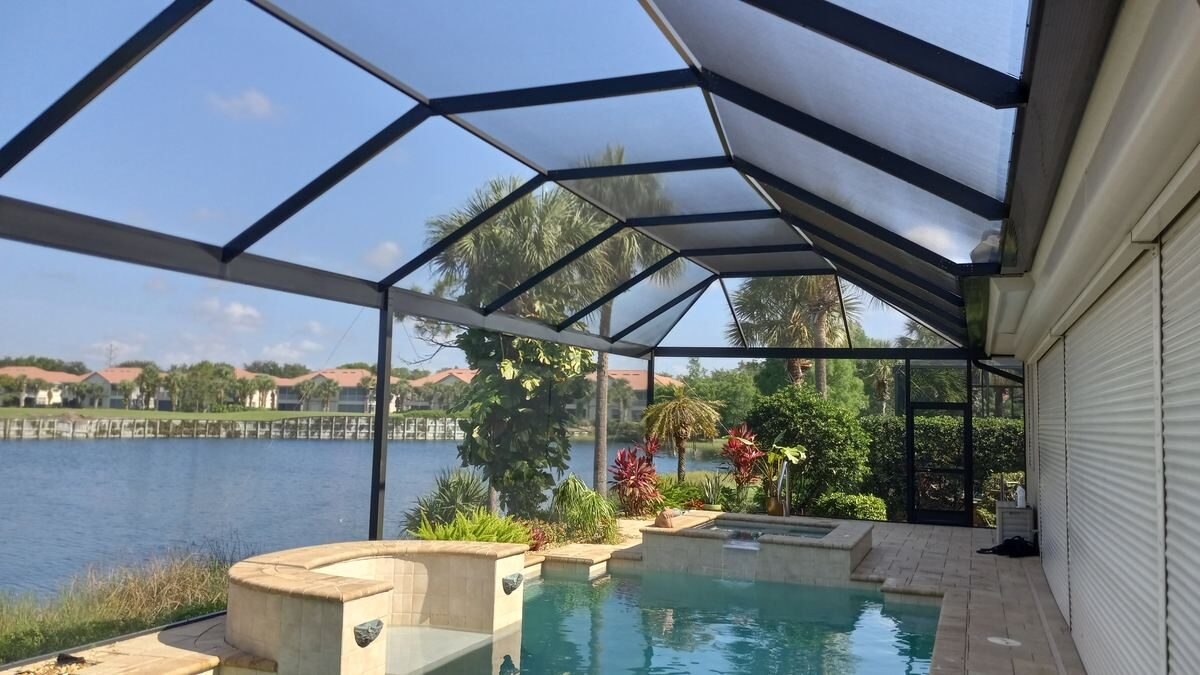 Inside a mansard cage over a pool on a lake
